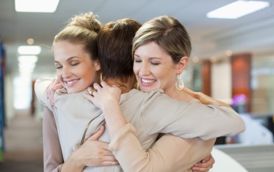 Three Women Hugging Photo